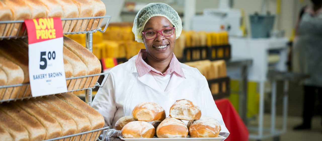 A Shoprite employee holdings freshly baked bread